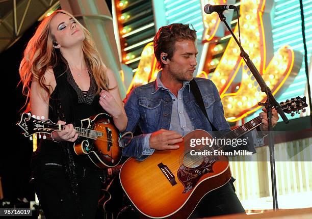 Recording artists Cheyenne Kimball and Tom Gossin of the band Gloriana perform during the Academy of Country Music all-star concert at the Fremont...