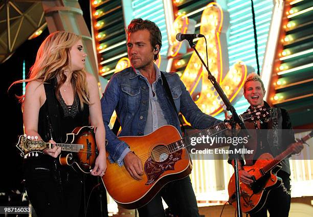 Recording artists Cheyenne Kimball, Tom Gossin and Mike Gossin of the band Gloriana perform during the Academy of Country Music all-star concert at...