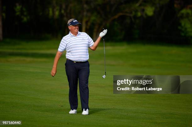 Colin Montgomerie of Scotland makes an approach shot on the 10th hole during round two of the U.S. Senior Open Championship at The Broadmoor Golf...