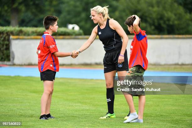 Referee Joy Neuville jokes with kids during the Grand Prix Series - Rugby Seven match between Ireland and Poland on June 29, 2018 in Marcoussis,...