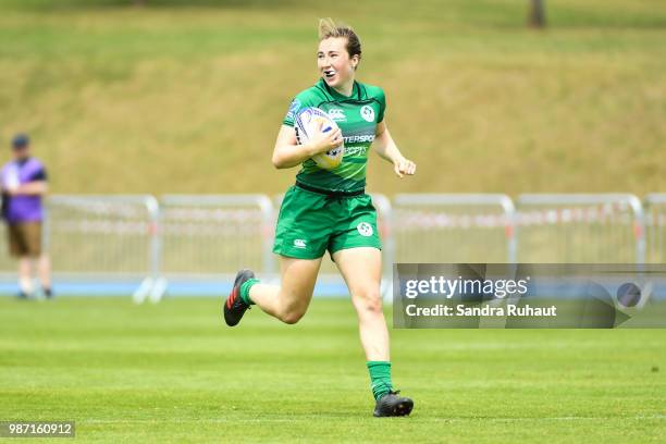 Eve Higgins of Ireland runs to score a try during the Grand Prix Series - Rugby Seven match between Ireland and Poland on June 29, 2018 in...