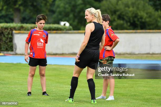 Referee Joy Neuville jokes with kids during the Grand Prix Series - Rugby Seven match between Ireland and Poland on June 29, 2018 in Marcoussis,...