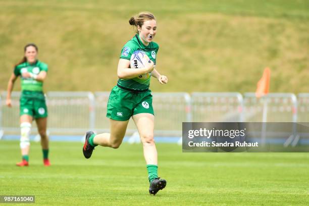 Eve Higgins of Ireland runs to score a try during the Grand Prix Series - Rugby Seven match between Ireland and Poland on June 29, 2018 in...
