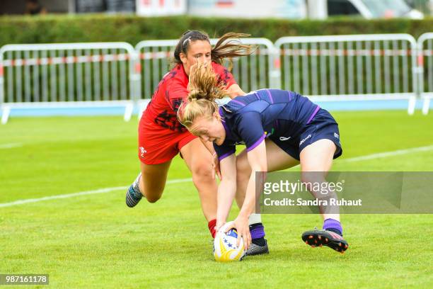 Elizabeth Musgrove of Scotland scores a try during the Grand Prix Series - Rugby Seven match between Wales and Scotland on June 29, 2018 in...
