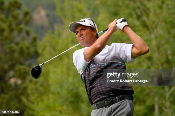 Stephen Ames of Canada makes a tee shot on the 10th hole during round two of the U.S. Senior Open Championship at The Broadmoor Golf Club on June 29,...