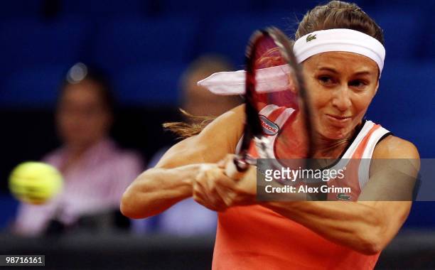 Gisela Dulko of Argentina plays a backhand during her first round match against Jelena Jankovic of Serbia at day three of the WTA Porsche Tennis...