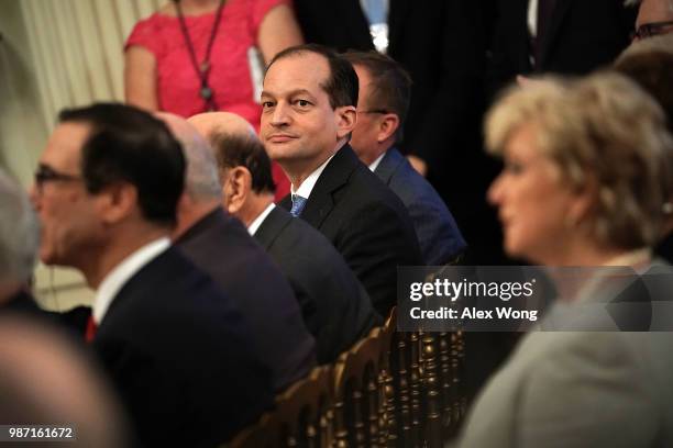 Secretary of Labor Alex Acosta attends an event at the East Room of the White House June 29, 2018 in Washington, DC. Trump held the event for...