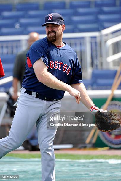 Firstbaseman Kevin Youkilis of the Boston Red Sox warms up prior to an exhibition game on April 3, 2010 against the Washington Nationals at Nationals...