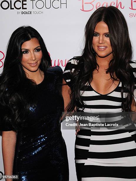 Kim Kardashian and Khloe Kardashian attend the Beach Bunny Swimwear's grand opening party on April 27, 2010 in Los Angeles, California.