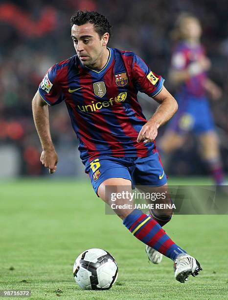 Barcelona's midfielder Xavi Hernandez controls the ball during their Spanish League football match at the Camp Nou Stadium in Barcelona, on April 3,...