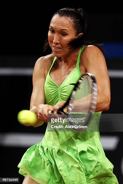 Jelena Jankovic of Serbia plays a backhand during her first round match against Gisela Dulko of Argentina at day three of the WTA Porsche Tennis...