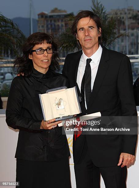 Directors Daniela Thomas and Walter Salles pose with the Best Actress Award accepted on behalf of Sandra Corveloni for her role in the movie "Linha...