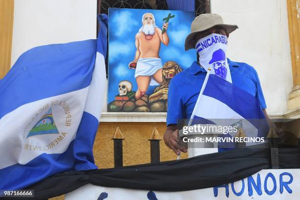 Man takes part in a protest in demand of Nicaraguan President Daniel Ortega's resignation and justice for those killed during repression, at the...