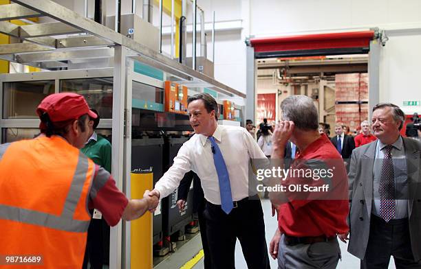 David Cameron, the leader of the Conservative party, visits a Coca-Cola factory on April 28, 2010 in Wakefield, England. The three main political...