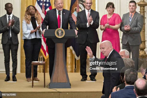 Representative Kevin Brady, a Republican from Texas and chairman of the House Ways and Means Committee, bottom right, waves while being introduced by...