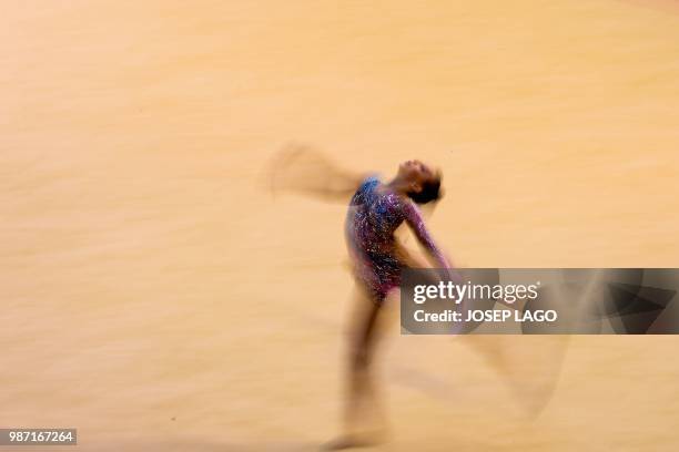 Serbian Nastasija Gvozdic competes during the women's rhythmic gymnastics individual qualification at the XVIII Mediterranean Games in Reus near to...