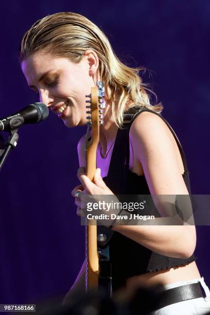 Ellie Rowsell of Wolf Alice supports Liam Gallagher on stage at Finsbury Park on June 29, 2018 in London, England.