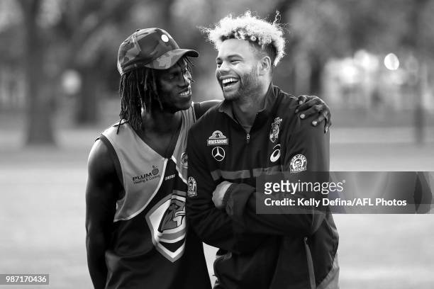 Jason Johannisen has a chat with a footballer and member of the African football community during the inaugural "Great African-Australian Football...