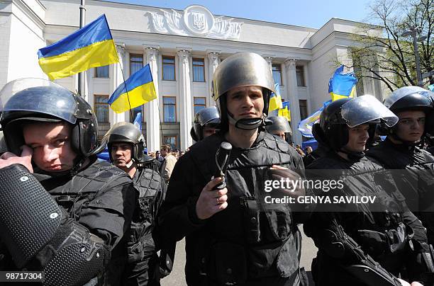 Riot police stay during a protest rally in front of Ukrainian Parliament in Kiev on April 27, 2010. Ukraine's parliament erupted into chaos as it...