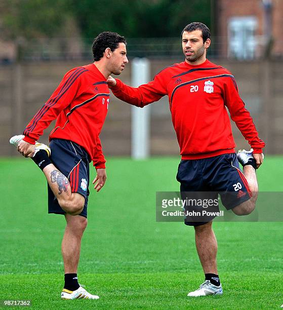 Maxi Rodriguez and Javier Mascherano of Liverpool in action during a training session prior to their UEFA Europa League semi-final, second leg match...