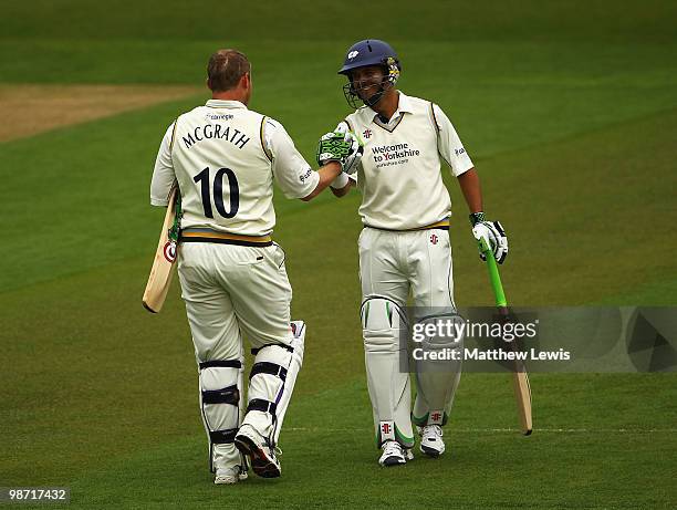 Jacques Rudolf of Yorkshire congratulates Anthony McGrath of Yorkshire on his century during the LV County Championship match between Yorkshire and...