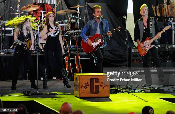 Cheyenne Kimball, Rachel Reinert, Tom Gossin and Mike Gossin of the band Gloriana perform during the Academy of Country Music all-star concert at the...