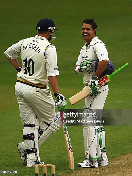 Jacques Rudolf of Yorkshire congratulates Anthony McGrath of Yorkshire on his century during the LV County Championship match between Yorkshire and...