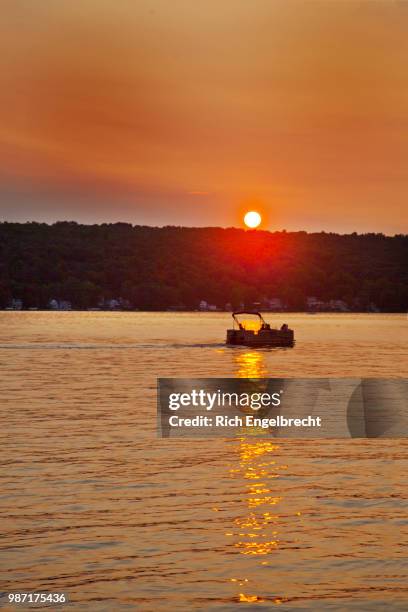 conesus sunset cruise - pontoon boat stock pictures, royalty-free photos & images