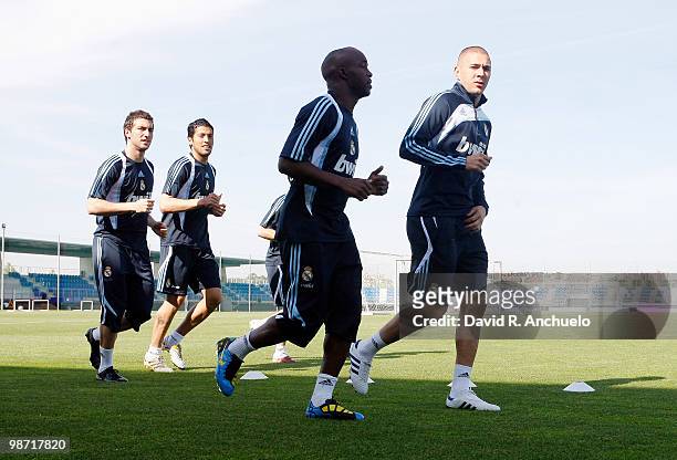 Real Madrid players Gonzalo Higuain, Ezequiel Garay, Lassana Diarra and Karim Benzema run during a training sessiona at Valdebebas on April 28, 2010...