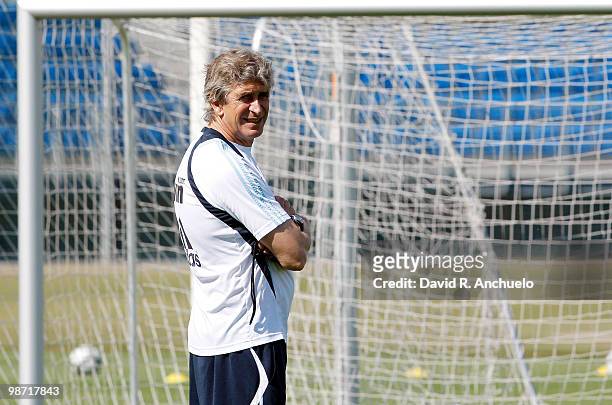 Real Madrid coach Manuel Pellegrini looks on during a training sessiona at Valdebebas on April 28, 2010 in Madrid, Spain.