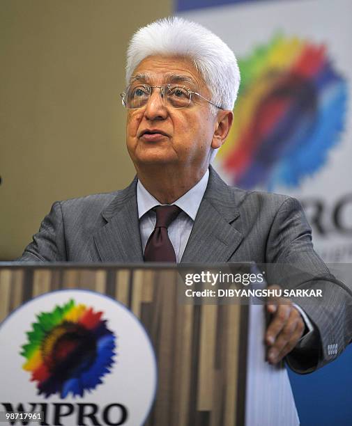 Chairman of Indian software company Wipro, Azim Premji gestures as he announces company financial results at the Wipro campus in Bangalore on April...