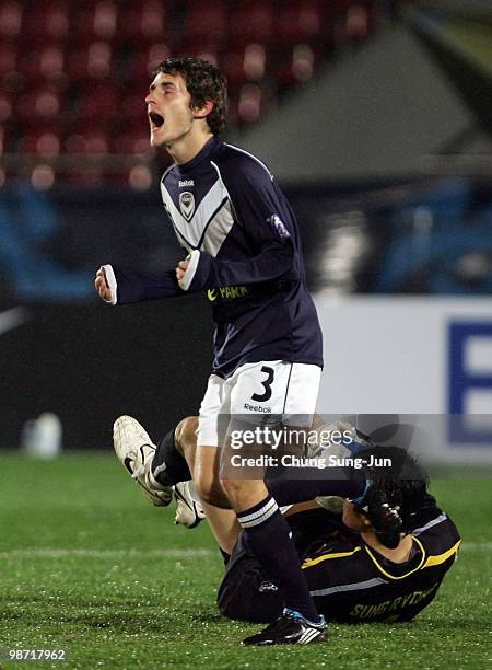 Mate Dugandzic of Melbourne Victory and Jung Sung-Ryong of Seongnam Ilhwa FC's GK compete for the ball during the AFC Champions League group E match...