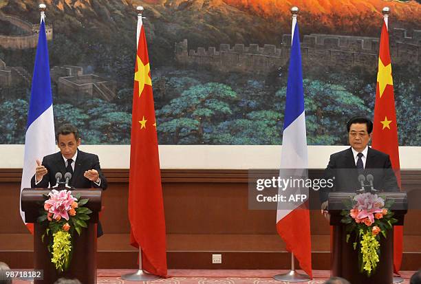 French President Nicolas Sarkozy attends a press conference with China's President Hu Jintao at the Great Hall of the People in Beijing on April 28,...
