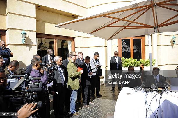 Joachim Chissano , head of the mediation of the SADC , flanked by Charles N'Kakula ,member of the mediation, talks to journalists during the...