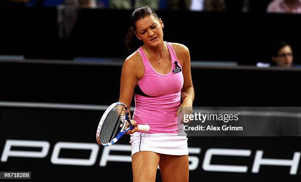 Agnieszka Radwanska of Poland reacts during her second round match against Shahar Peer of Israel at day three of the WTA Porsche Tennis Grand Prix...