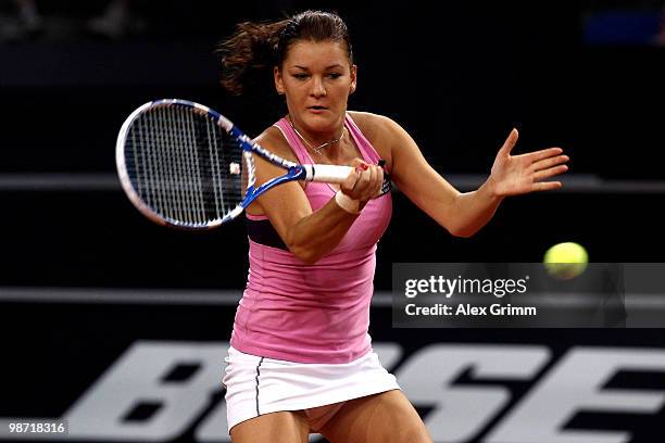 Agnieszka Radwanska of Poland plays a forehand during her second round match against Shahar Peer of Israel at day three of the WTA Porsche Tennis...