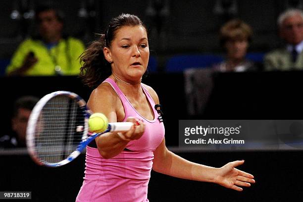 Agnieszka Radwanska of Poland plays a forehand during her second round match against Shahar Peer of Israel at day three of the WTA Porsche Tennis...