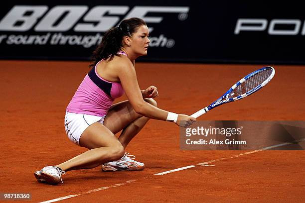 Agnieszka Radwanska of Poland reacts during her second round match against Shahar Peer of Israel at day three of the WTA Porsche Tennis Grand Prix...