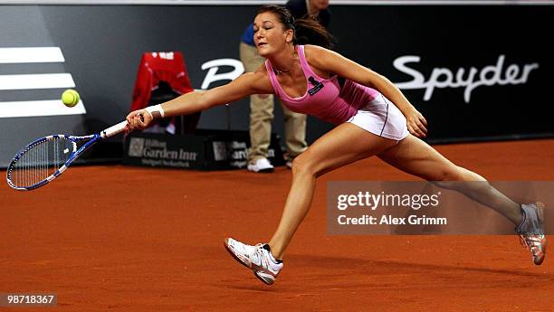 Agnieszka Radwanska of Poland plays a forehand during her second round match against Shahar Peer of Israel at day three of the WTA Porsche Tennis...