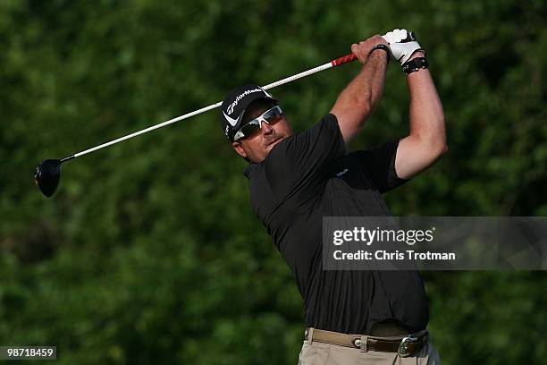 Chris Couch tees off on the 13th hole during the continuation of the weather delayed second round of the Zurich Classic at TPC Louisiana on April 24,...