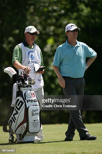 Chris Riley looks on with his caddie from the 14th hole during the final round of the Zurich Classic at TPC Louisiana on April 25, 2010 in Avondale,...