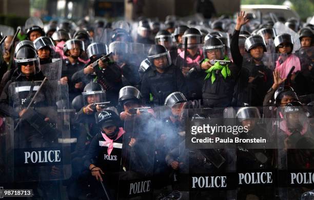 Members of the Thai military police shoot at red shirt protesters during a gun battle as violence flares outside the city on April 28, 2010 in...