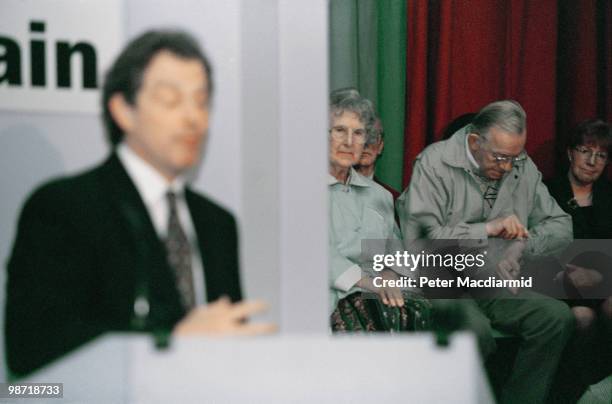 Man checks his watch during a speech by Labour Leader of the Opposition Tony Blair, Tamworth, Staffordshire, 9th April 1996. Blair is campaigning for...