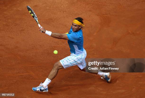 Rafael Nadal of Spain plays a backhand in his match against Philipp Kohlschreiber of Germany during day four of the ATP Masters Series - Rome at the...