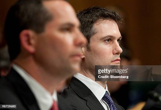 Joshua Birnbaum, former managing director of structured products group trading with Goldman Sachs, right, listens during a Senate Homeland Security...