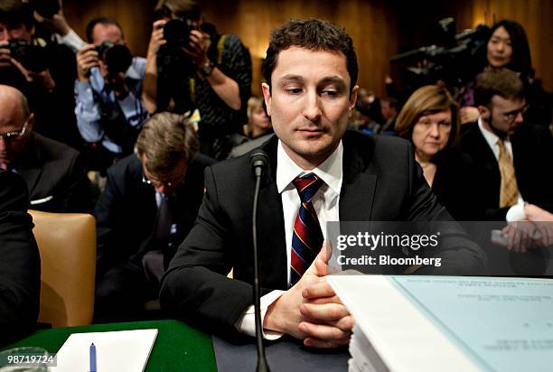 Fabrice Tourre, executive director of structured products group trading with Goldman Sachs Group Inc., center, waits to testify at a Senate Homeland...