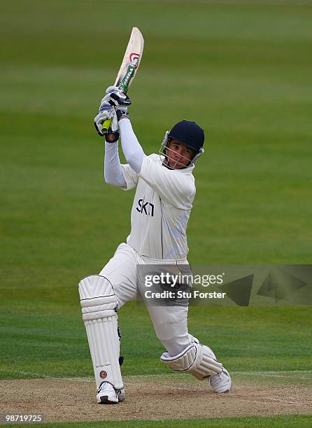 Warwickshire batsman Neil Carter cuts a ball to the boundary during day two of the LV County Championship division one match between Warwickshire and...