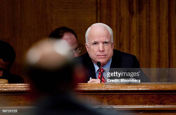 Senator John McCain, a Republican from Arizona, right, questions Lloyd C. Blankfein, chairman and chief executive officer of Goldman SachsÊGroup...