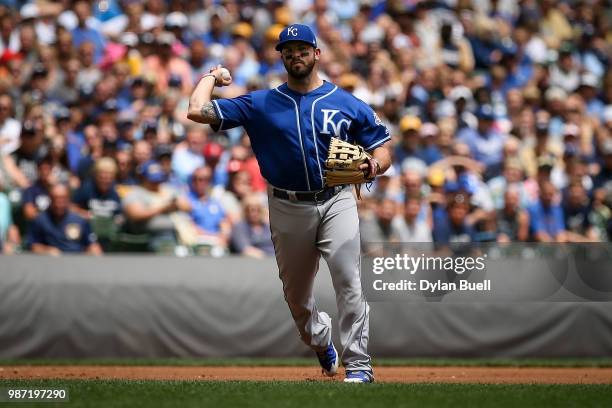 Mike Moustakas of the Kansas City Royals throws to first base in the second inning against the Milwaukee Brewers at Miller Park on June 27, 2018 in...