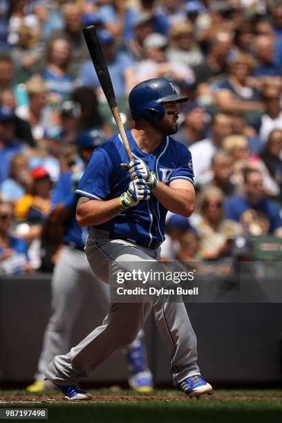 Mike Moustakas of the Kansas City Royals hits a single in the fourth inning against the Milwaukee Brewers at Miller Park on June 27, 2018 in...